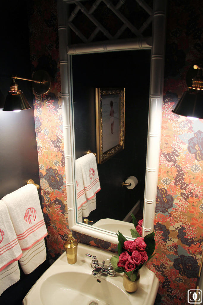 Gold frames, powder room, bamboo mirror, brass lights, wallpaper powder bath