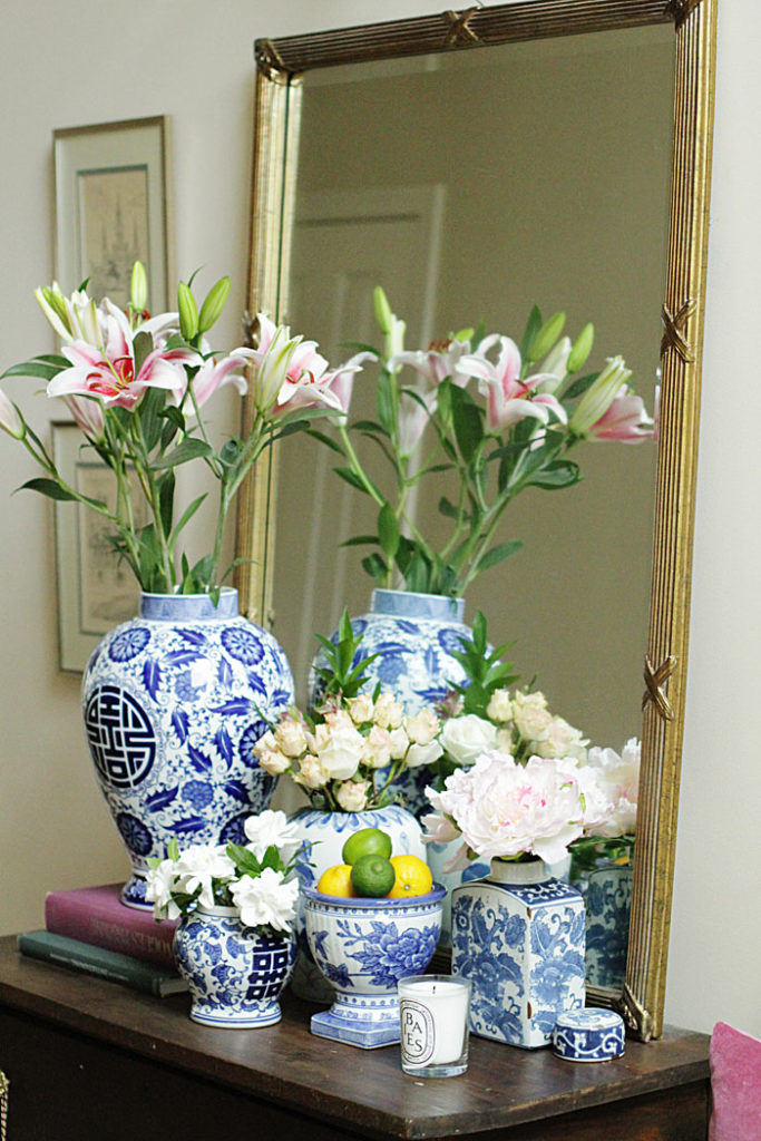blue and white ginger jars, gold mirror