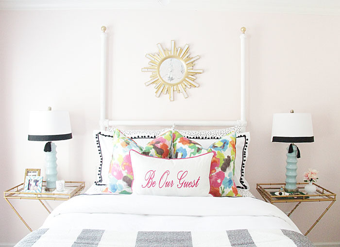 guest room, colorful, floral pillow, sunburst mirror