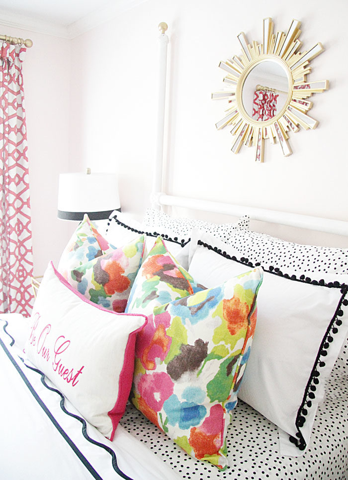 guest room, colorful, floral pillow, sunburst mirror