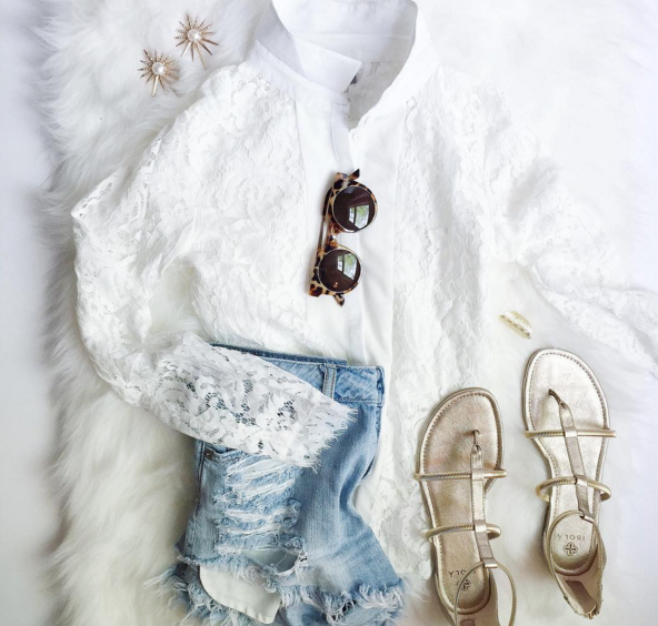 Pairing a dainty lace top with distressed denim shorts sis a fun play on texture for Spring.