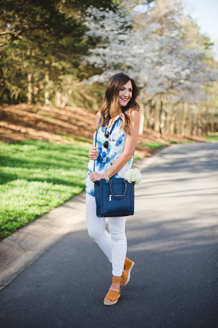 This fun floral top, navy cross body and trendy wedges from Charming Charlie make for a great Spring outfit.