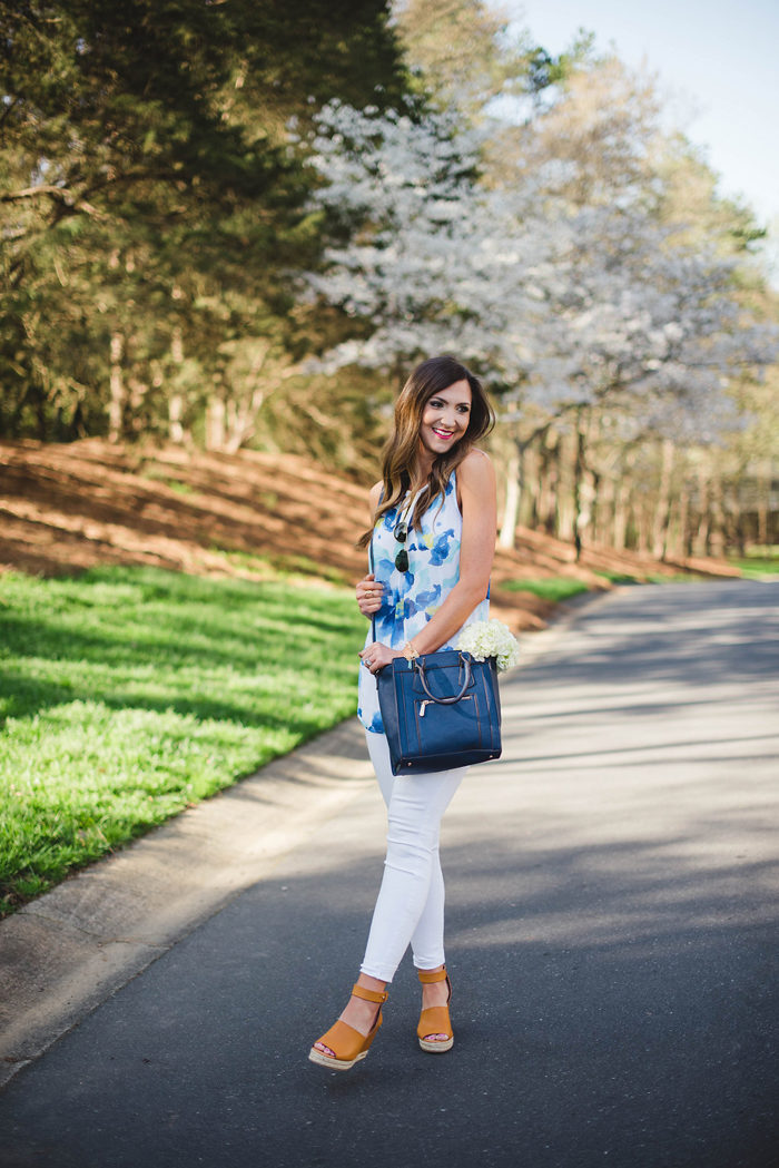 This fun floral top, navy cross body and trendy wedges from Charming Charlie make for a great Spring outfit. 