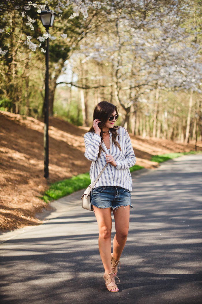 A laid back, casual outfit with a light linen tunic and distressed denim shorts!