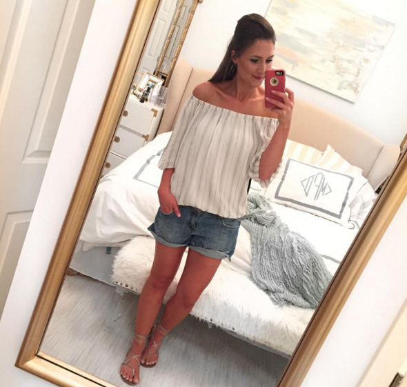 Off the shoulder top and distressed denim shorts