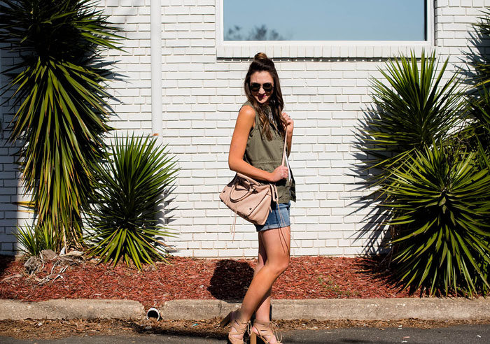 Pair denim shorts with a military vest and add southwestern accessories for a fun Summer look.