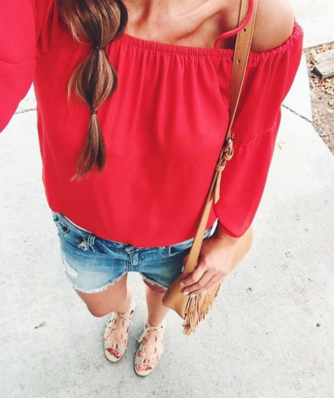 Red off cold shoulder top with distressed denim