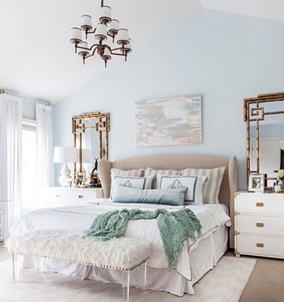Calming master bedroom retreat mixing gold, light blue and white for a classic chic feel.