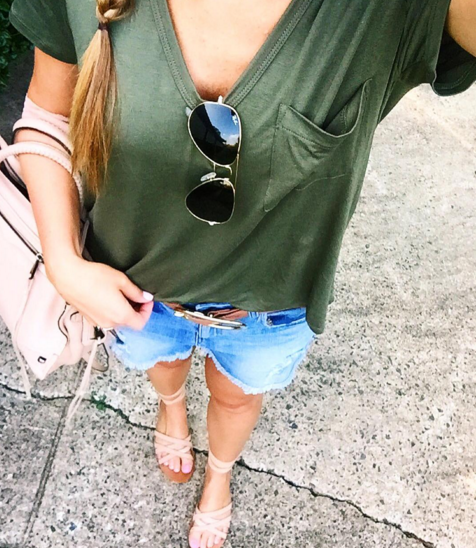 Pair your favorite olive green t-shirt with denim shorts and a blush pink bag for a casual weekend look