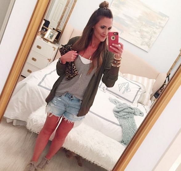 Wear an olive green bomber jacket with your favorite denim shorts to make the transition to Fall