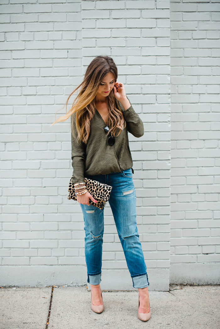 Blogger Mallory Fitzsimmons of Style Your Senses styles distressed boyfriend jeans with a Cooper and Ella crossover top and a cheetah clutch.