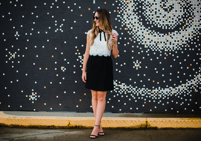 Blogger Mallory Fitzsimmons of Style Your Senses wears a girly black and white lace dress with peter pan collar and bow