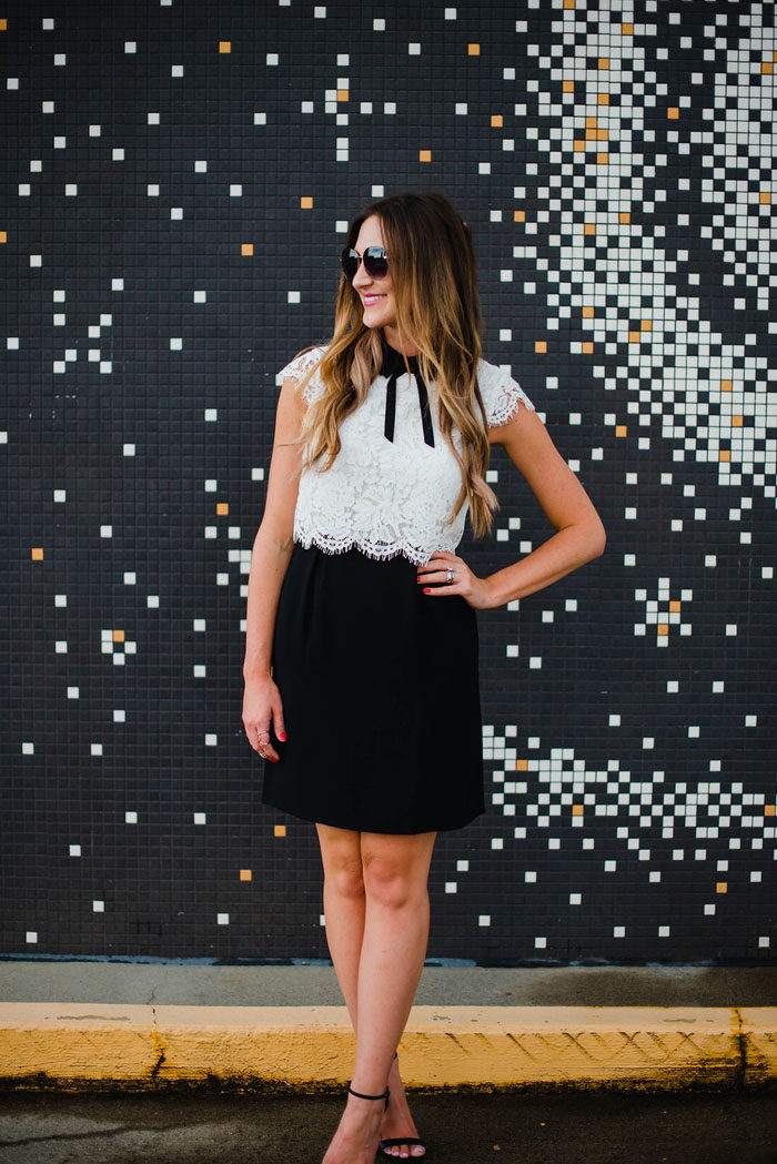 Blogger Mallory Fitzsimmons of Style Your Senses wears a girly black and white lace dress with peter pan collar and bow