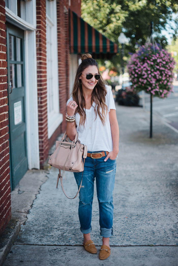 Blogger Mallory Fitzsimmons of Style Your Senses wears a Madewell white t-shirt and distressed boyfriend denim with loafers for a casual chic Fall look.