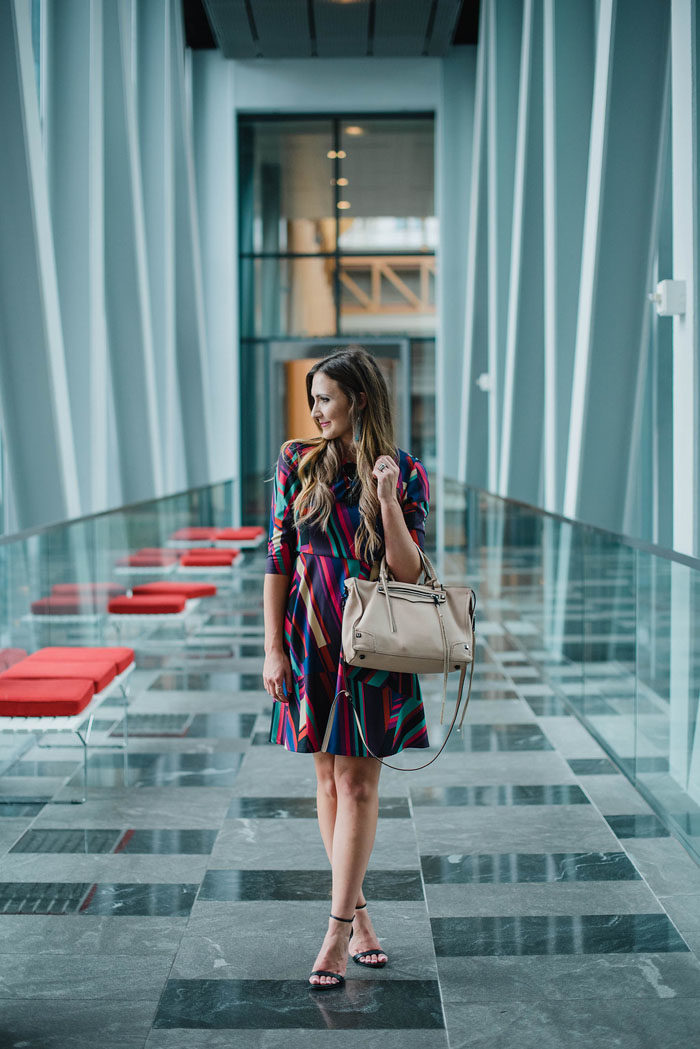 Blogger Mallory Fitzsimmons of Style Your Senses wears a Donna Morgan geometric print dress for Fall office wear.
