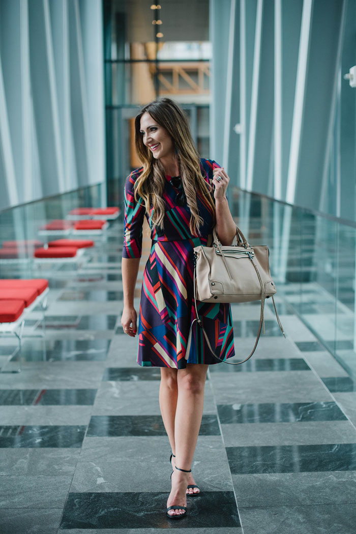 Blogger Mallory Fitzsimmons of Style Your Senses wears a Donna Morgan geometric print dress for Fall office wear.