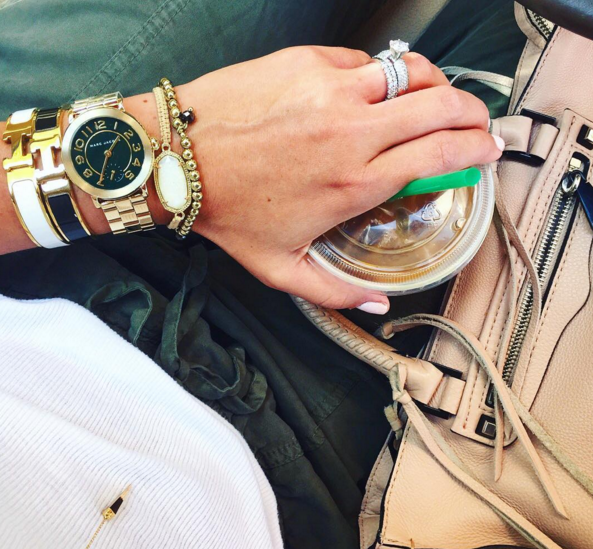 Marc Jacobs gold watch as part of a Fall arm stack