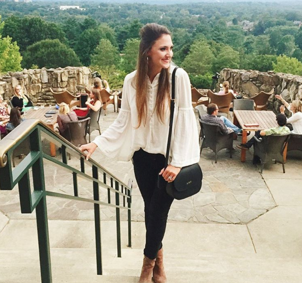 Blogger Mallory Fitzsimmons of Style Your Senses wears this bell sleeve Free people top and black skinny jeans for a weekend in Asheville