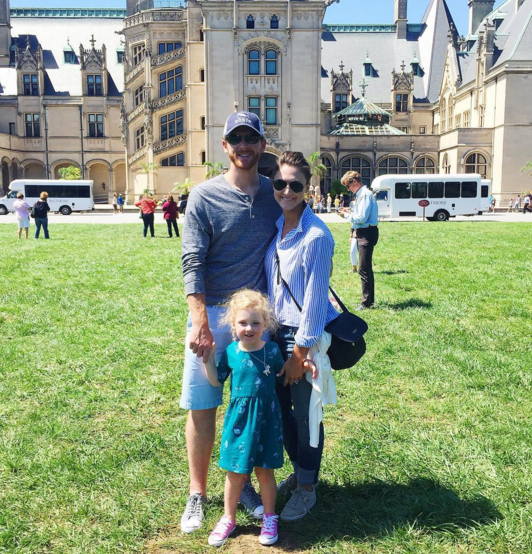 A family photo in from of the Biltmore Mansion