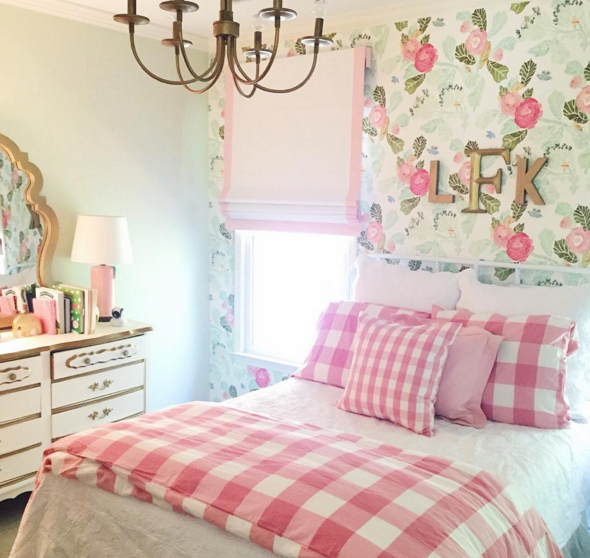 Gorgeous and feminine little girls room with floral wallpaper and gingham bedding