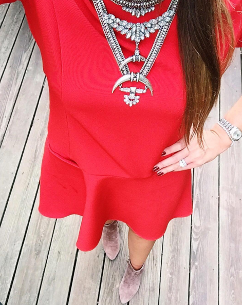 Cute red drop waist dress paired with a statement necklace.