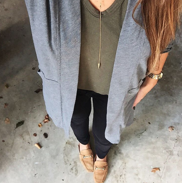 A casual and cozy Fall outfit with a lightweight cardigan, black denim and an olive green t-shirt.