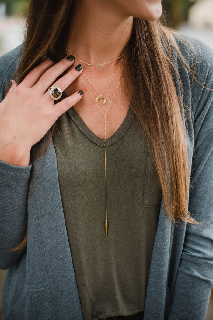 Dainty layered gold BaubleBar necklaces.