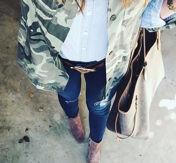 Camo jacket paired with skinny jeans and booties