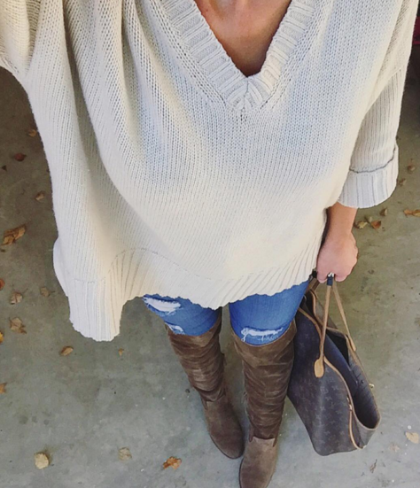 Oversized sweater paired with skinny jeans and over the knee boots