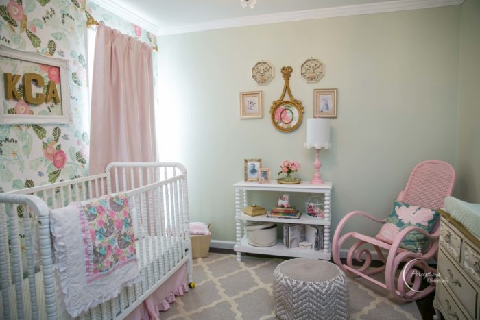 Beautiful baby girl nursery with pink drapes, classic Jenny Lind crib and trellis rug