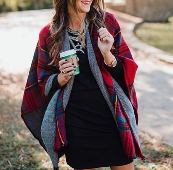 Blogger Mallory Fitzsimmons of Style Your Senses wears a plaid reversible cape and statement necklace for a cozy and festive Holiday look.