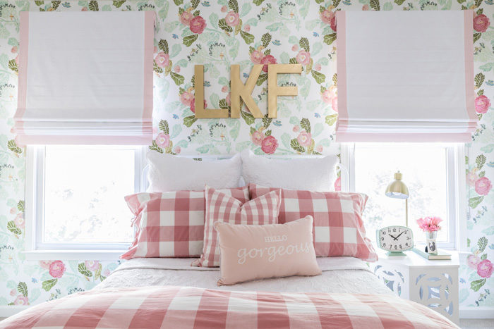 Big girl room reveal with floral wallpaper, gingham bedding and bold gold monogram over the bed featured by popular Texas lifestyle blogger, Style Your Senses