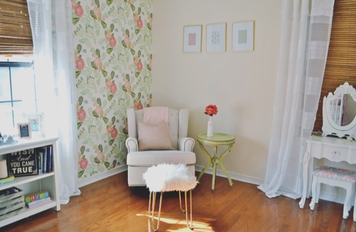 Beautiful baby girl nursery with floral wallpaper from Anthropologie and a classic Jenny Lind crib.