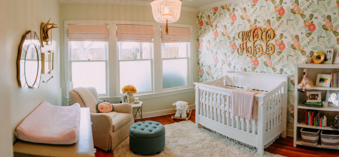 Beautiful Baby Girl nursery with floral wallpaper from Anthropologie, beaded chandelier and light pink roman shades.