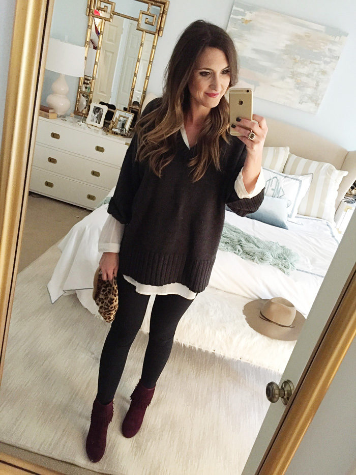 Blogger Mallory Fitzsimmons of Style Your Senses wears a layered tunic and over-sized sweater with tights and Isola booties for a transitional Holiday look