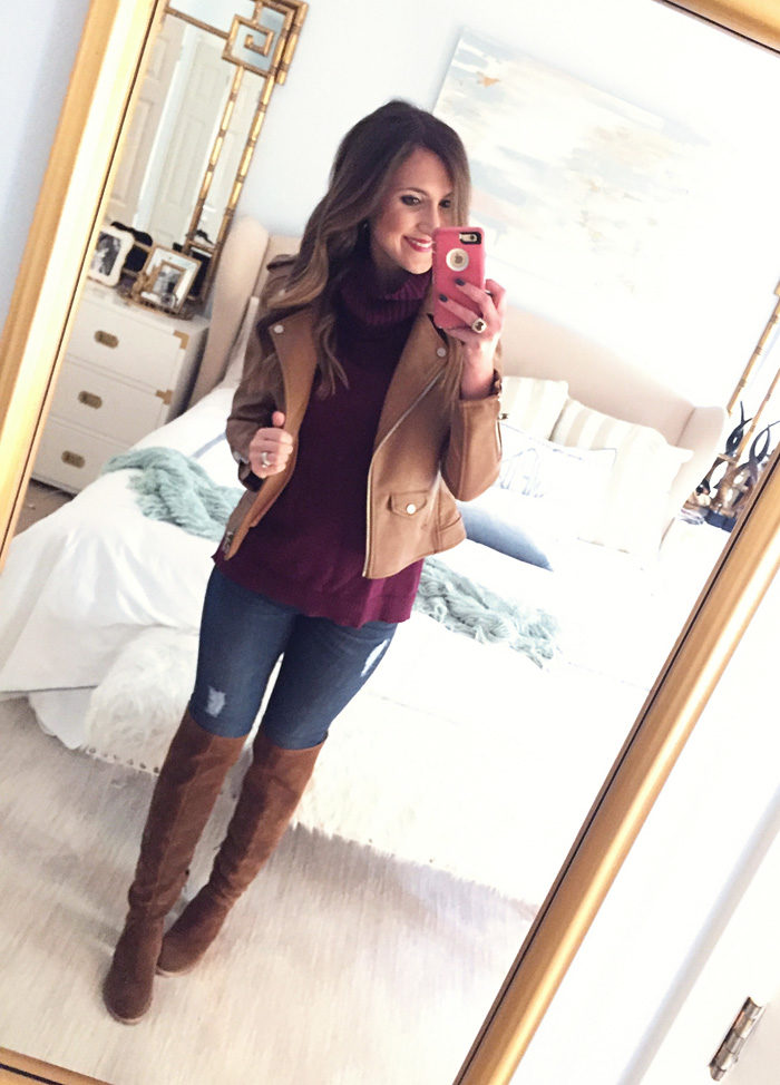 Blogger Mallory Fitzsimmons of Style Your Senses wears a faux leather moto jacket with a turtleneck sweater, skinny jeans and over the knee boots
