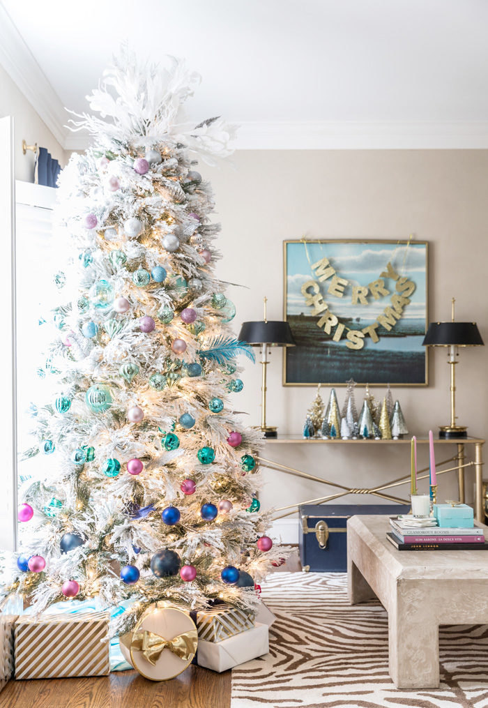 Blogger Mallory Fitzsimmons of Style Your Senses shares her Holiday Home Tour that includes this gorgeous flocked Christmas Tree with blue and pink ornaments - Our Holiday Home Tour featured by popular Texas lifestyle blogger, Style Your Senses