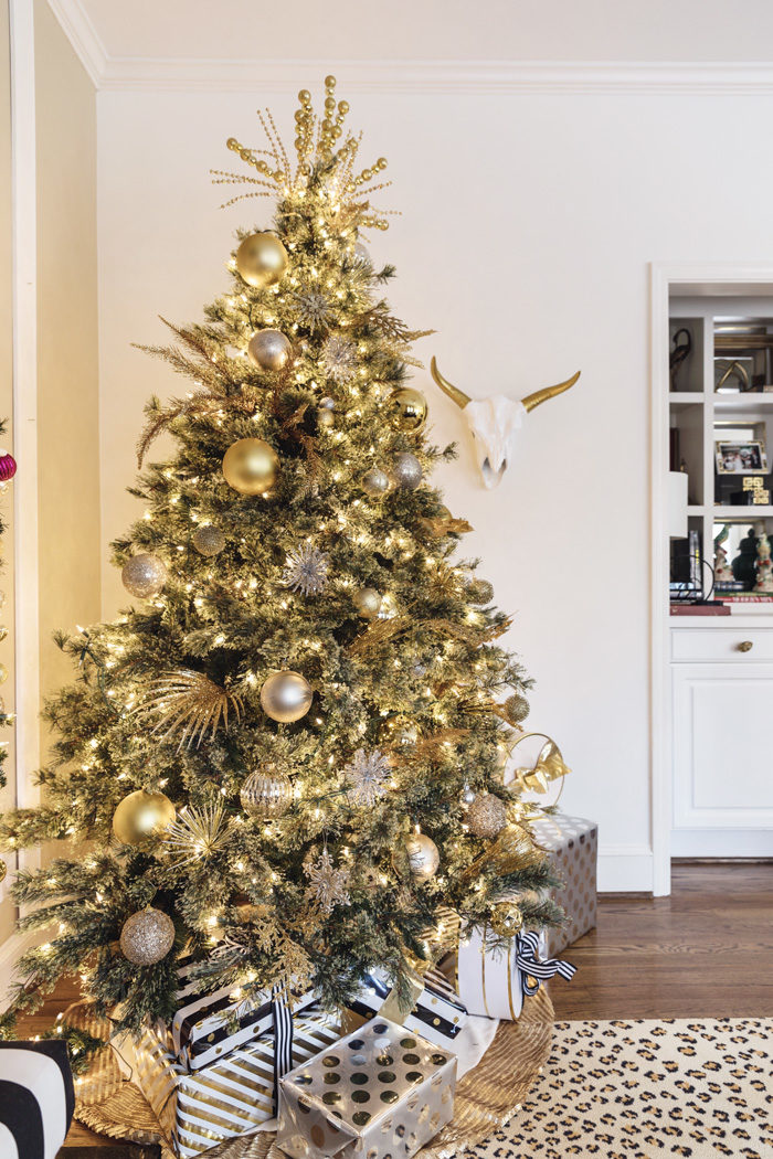 Blogger Mallory Fitzsimmons of Style Your Senses shares her Holiday Home Tour which includes this black and white living room and beautiful gold Christmas tree - Our Holiday Home Tour featured by popular Texas lifestyle blogger, Style Your Senses