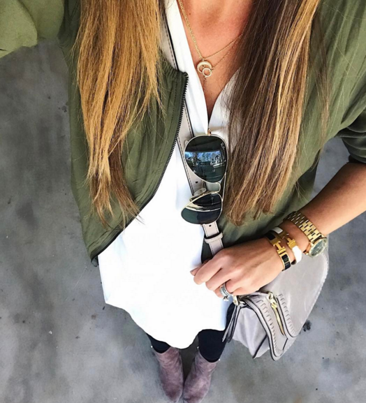 This ivory tunic paired with an army green bomber jacket and black skinny jeans is an easy, and on the go outfit for busy ladies
