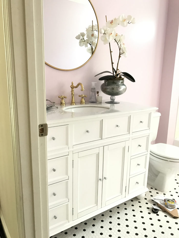 lilac bathroom with gold hardware