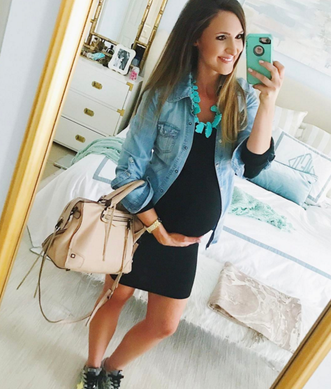 cute maternity outfit idea with black dress and chambray button up
