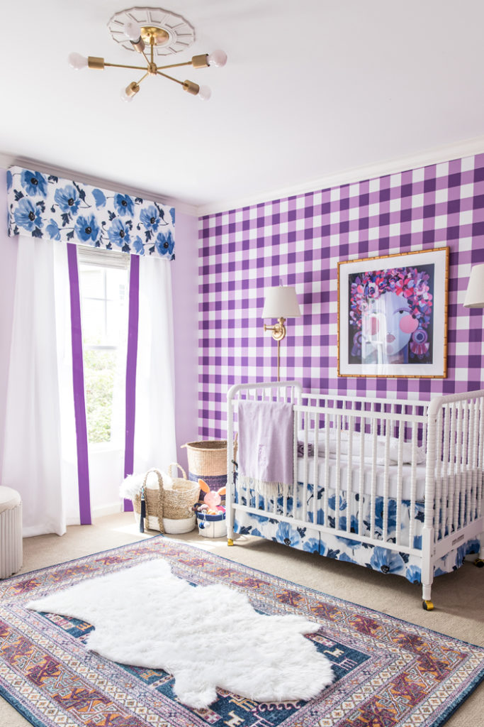 Bright and Bold baby girl nursery design with buffalo check wallpaper, floral fabric and abstract art