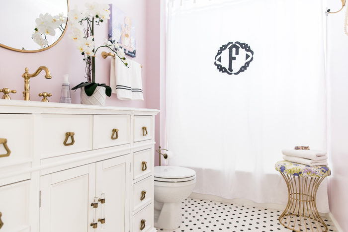 Shared girl's bathroom reveal | Lilac and gold bathroom with black and white tile, original art and applique monogram