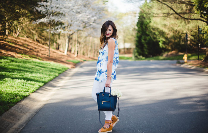 This fun floral top, navy cross body and trendy wedges from Charming Charlie make for a great Spring outfit.