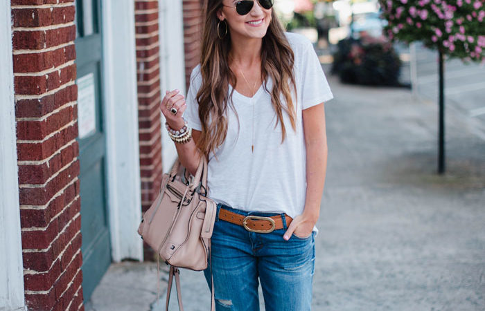 Blogger Mallory Fitzsimmons of Style Your Senses wears a Madewell white t-shirt and distressed boyfriend denim with loafers for a casual chic Fall look.