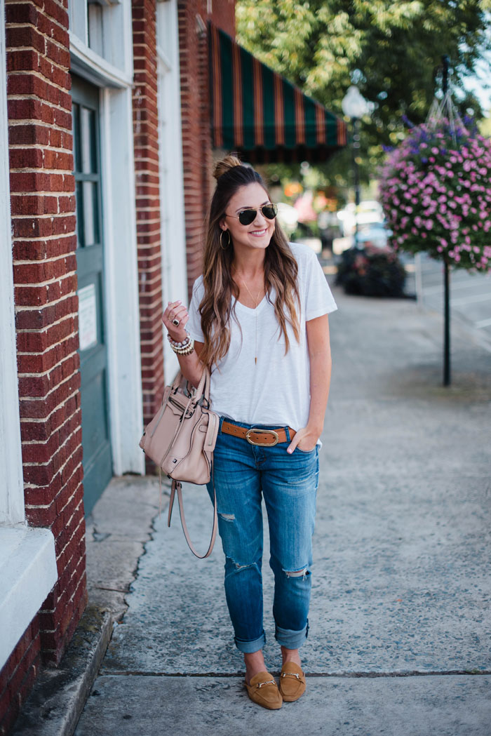 Blogger Mallory Fitzsimmons of Style Your Senses wears a Madewell white t-shirt and distressed boyfriend denim with loafers for a casual chic Fall look.