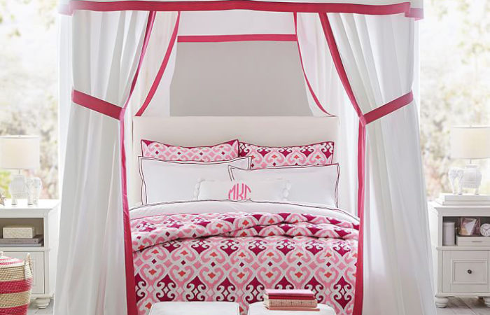 Gorgeous fabric canopy bed in girls room
