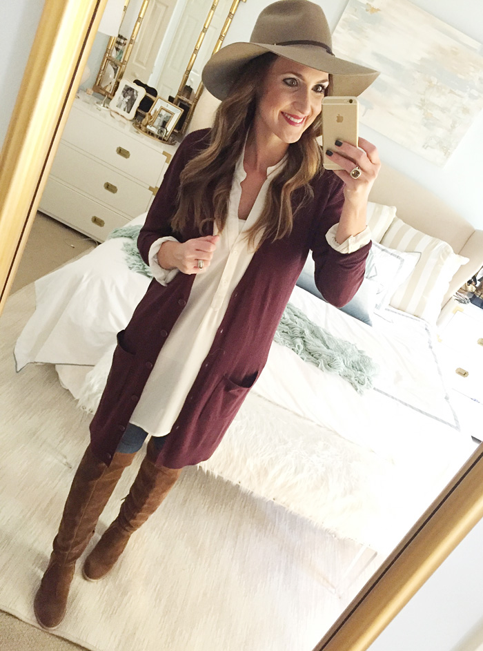 Blogger Mallory Fitzsimmons of Style Your Senses wears a plum tunic cardigan with skinny jeans and over the knee boots for a festive Thanksgiving outfit idea