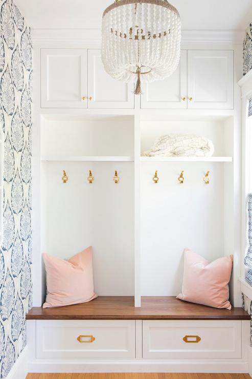 blue-lotus-mudroom-wallpaper-blush-pink-velvet-pillows-vintage-brass-pulls