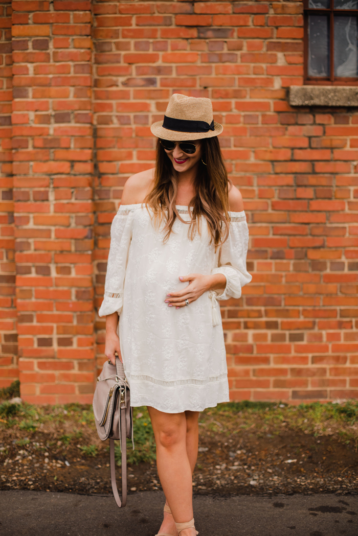 Blogger Mallory Fitzsimmons of Style Your Senses wears a non-maternity off the shoulder eyelet dress to style her 30 week bump for Spring